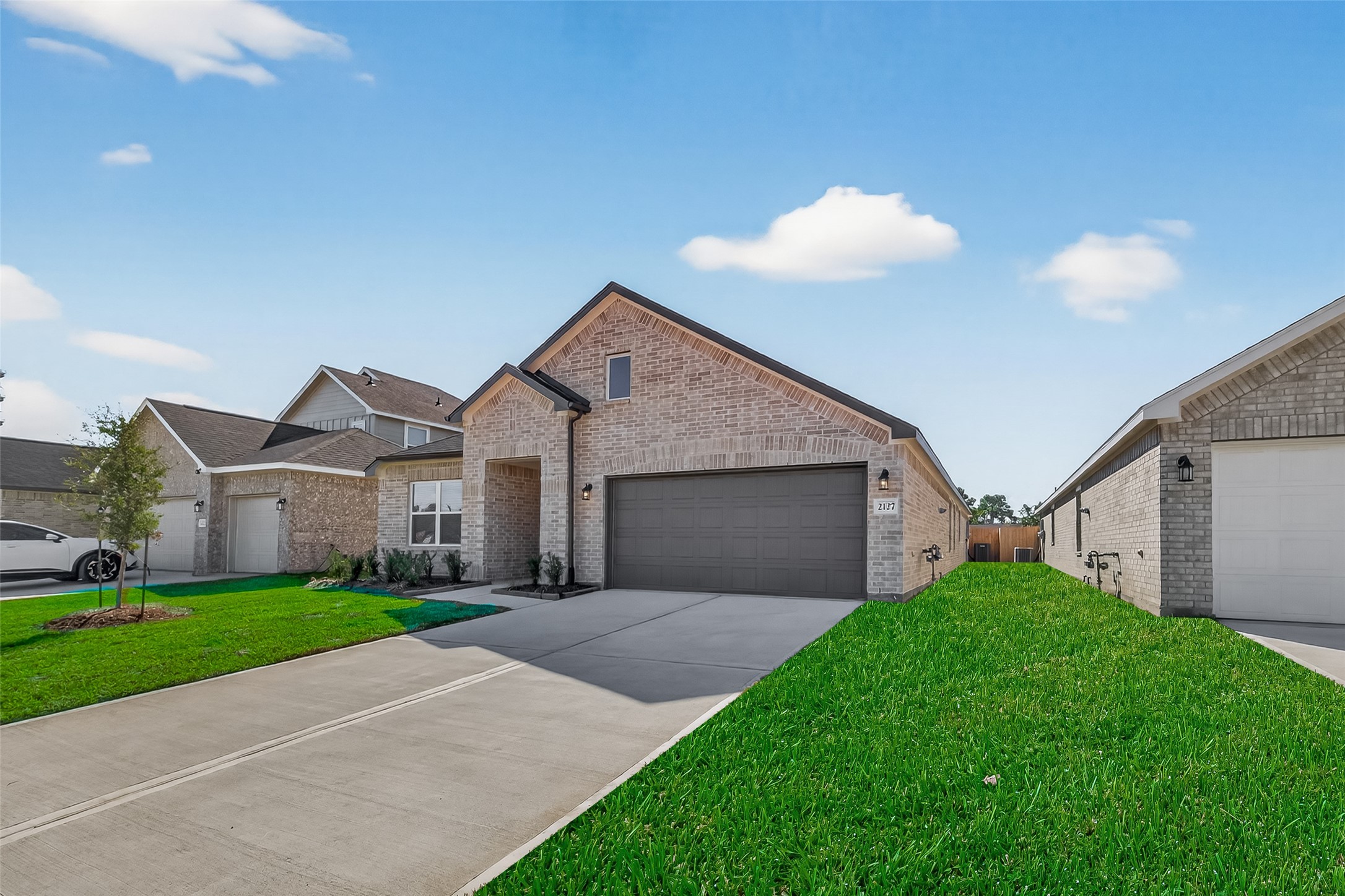 2111 Spring Hollow Drive Baytown, TX 77521 - Photo 3 of 42 a front view of house with yard and green space
