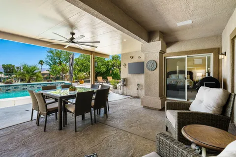 a view of a big dining room with furniture window and outside view