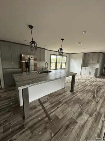 a living room with kitchen