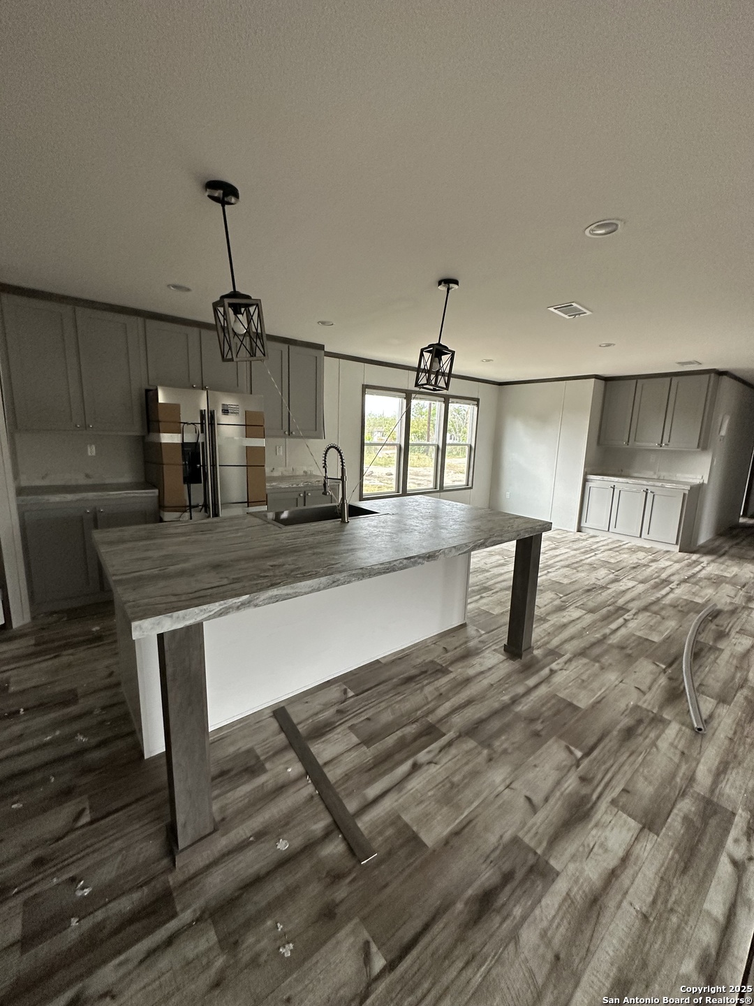 a living room with kitchen