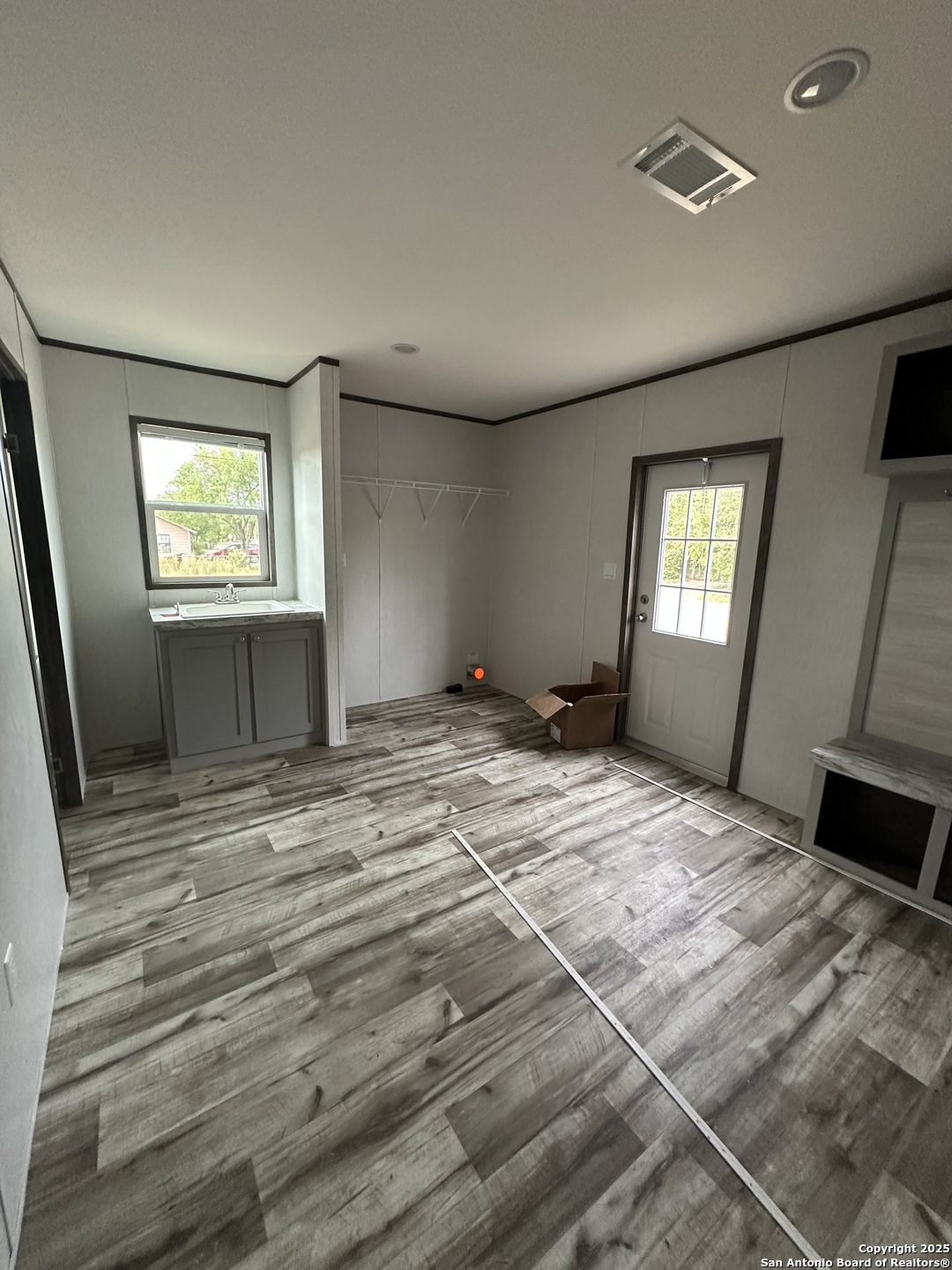 719 North Houston Street Sabinal, TX 78881 - Photo 6 of 7 a bedroom with a bed and a window