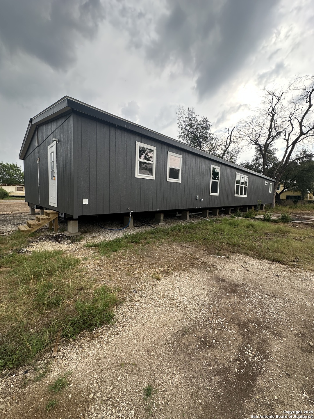 719 North Houston Street Sabinal, TX 78881 - Photo 7 of 7 a backyard of a house