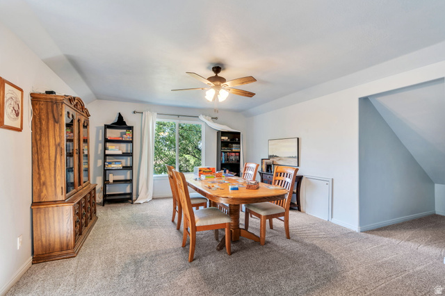1727 South Sandhill Road Orem, UT 84058 - Photo 15 of 27 Spacious room with sloped ceilings and light-colored carpeting