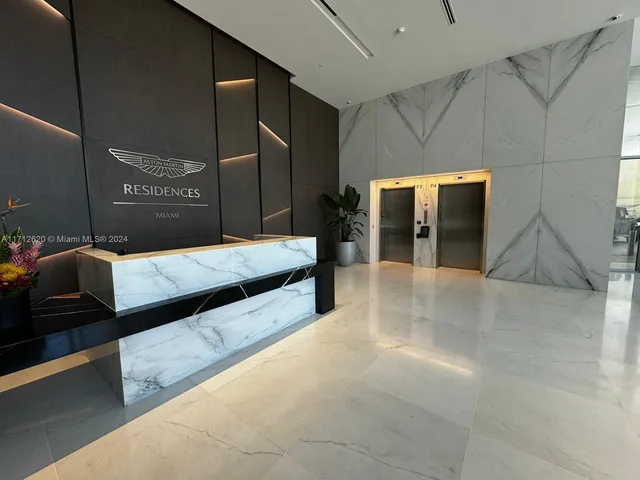 a lobby with a couch and a walk in closet