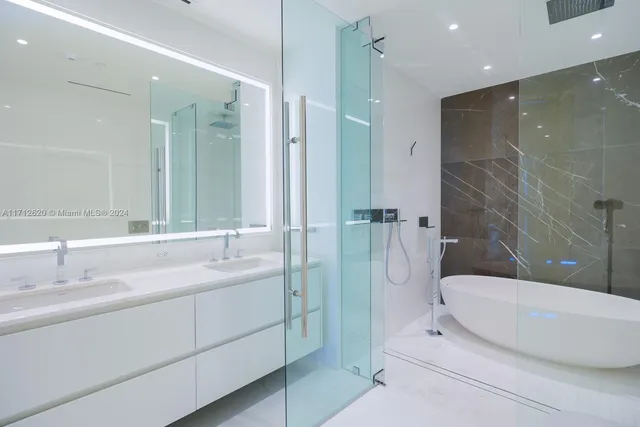 a kitchen with cabinets and wooden floor