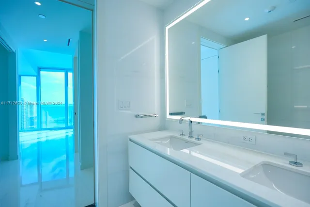 a kitchen with stainless steel appliances a microwave and refrigerator