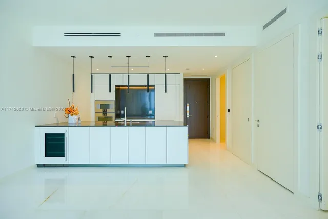 a view of an empty room with glass door