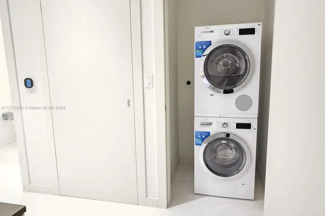 a view of a balcony with lake view and a floor to ceiling window