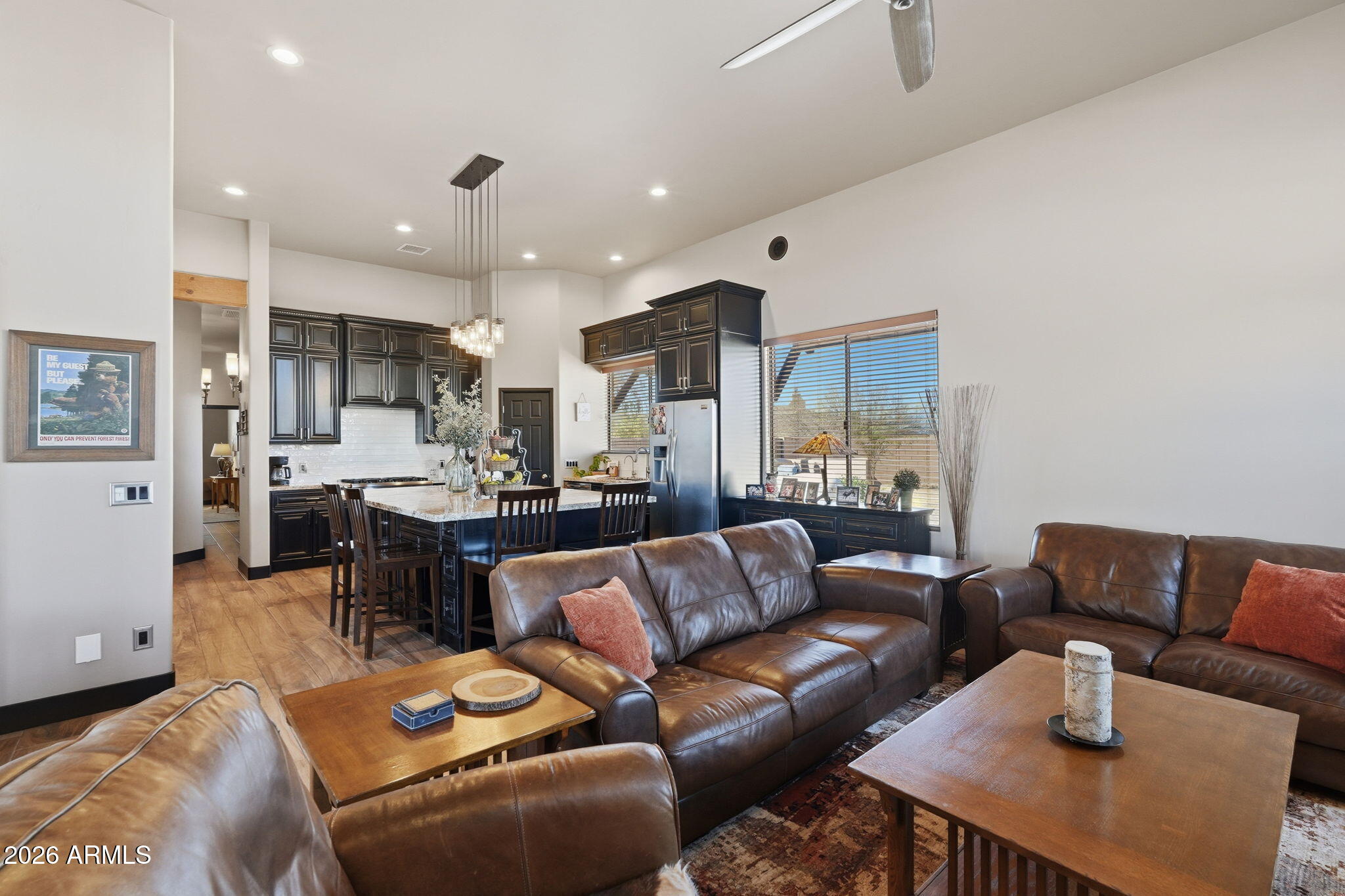 1114 East Carlise Road Phoenix, AZ 85086 - Photo 22 of 53 a living room with furniture kitchen view and a chandelier