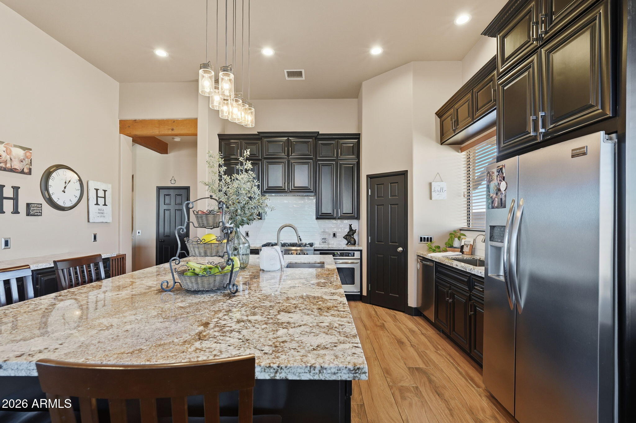 1114 East Carlise Road Phoenix, AZ 85086 - Photo 26 of 53 a kitchen with stainless steel appliances granite countertop a sink refrigerator and microwave