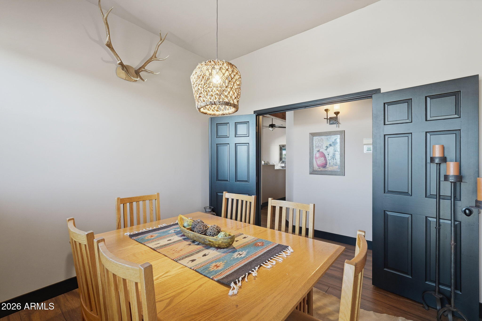 1114 East Carlise Road Phoenix, AZ 85086 - Photo 28 of 53 a view of a dining room with furniture wooden floor and chandelier