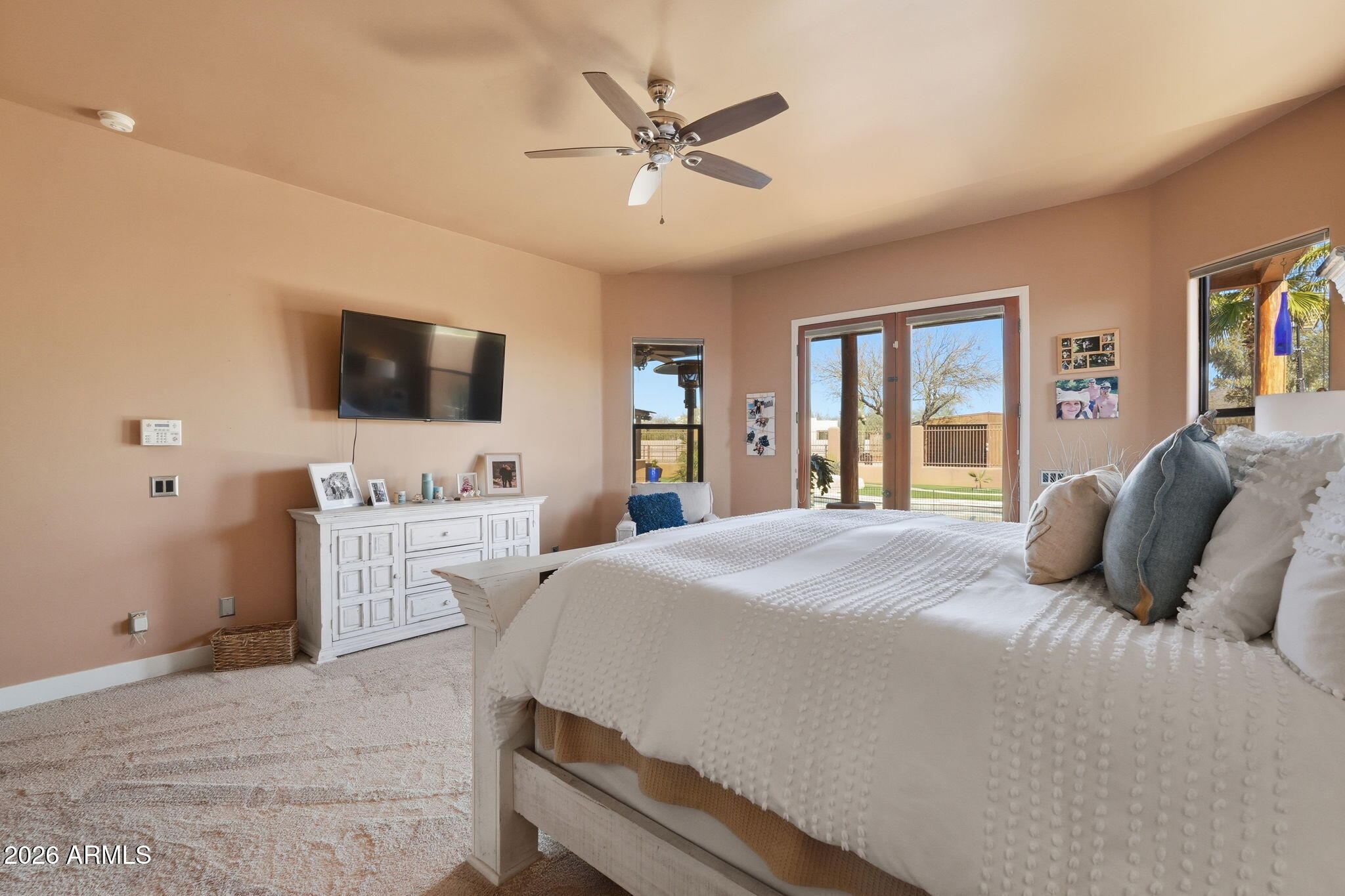 1114 East Carlise Road Phoenix, AZ 85086 - Photo 33 of 53 a spacious bedroom with a bed and a flat screen tv