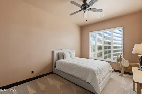 a bed room with a bed and a window