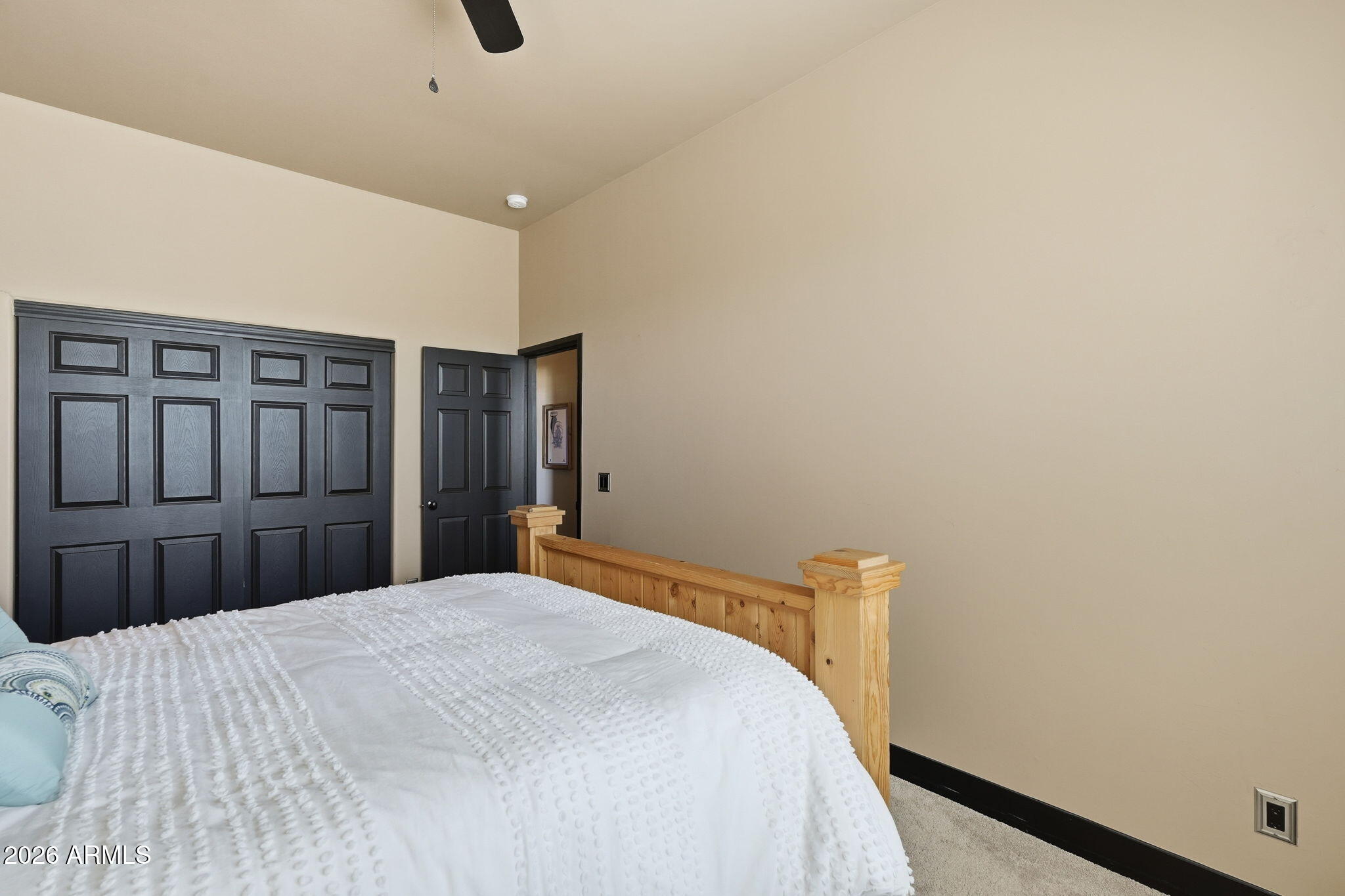 1114 East Carlise Road Phoenix, AZ 85086 - Photo 39 of 53 a bedroom with a bed and wooden floor