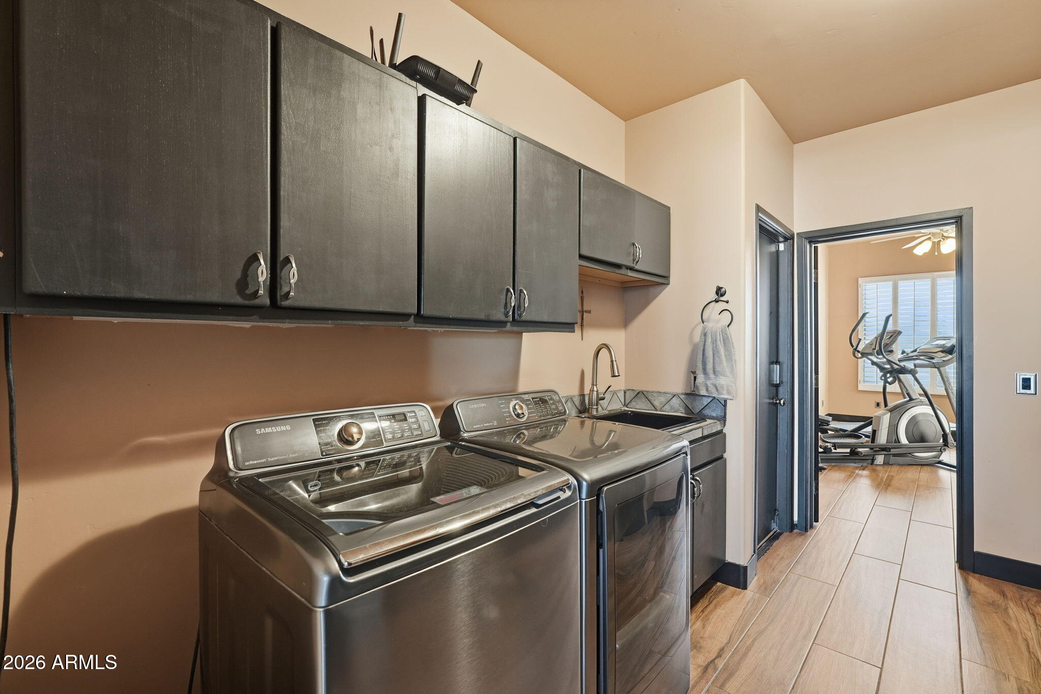 1114 East Carlise Road Phoenix, AZ 85086 - Photo 41 of 53 a kitchen with stainless steel appliances granite countertop a stove and a sink