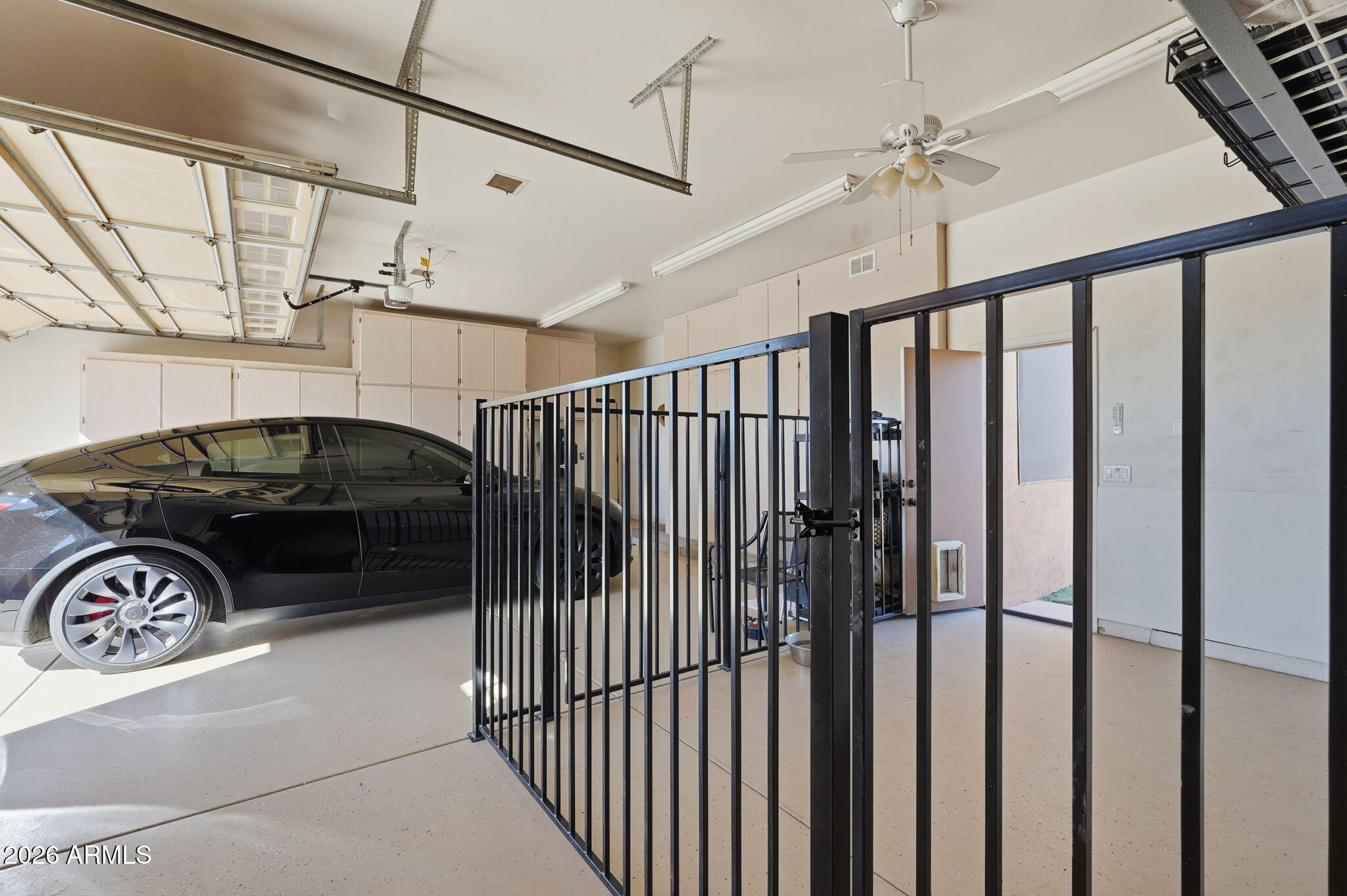 1114 East Carlise Road Phoenix, AZ 85086 - Photo 42 of 53 a view of a car garage with a car parked