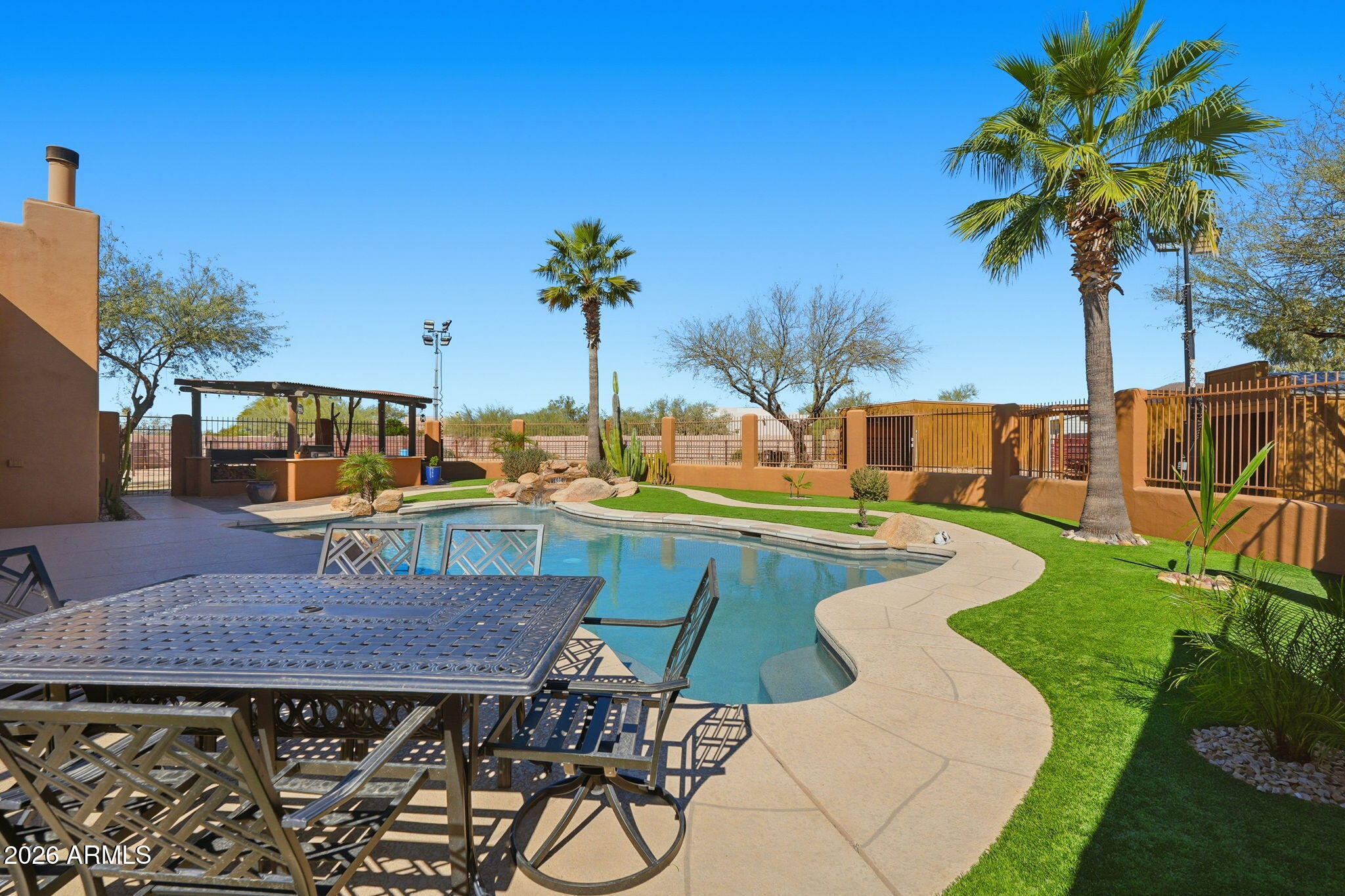 1114 East Carlise Road Phoenix, AZ 85086 - Photo 45 of 53 a view of swimming pool with a table and chairs
