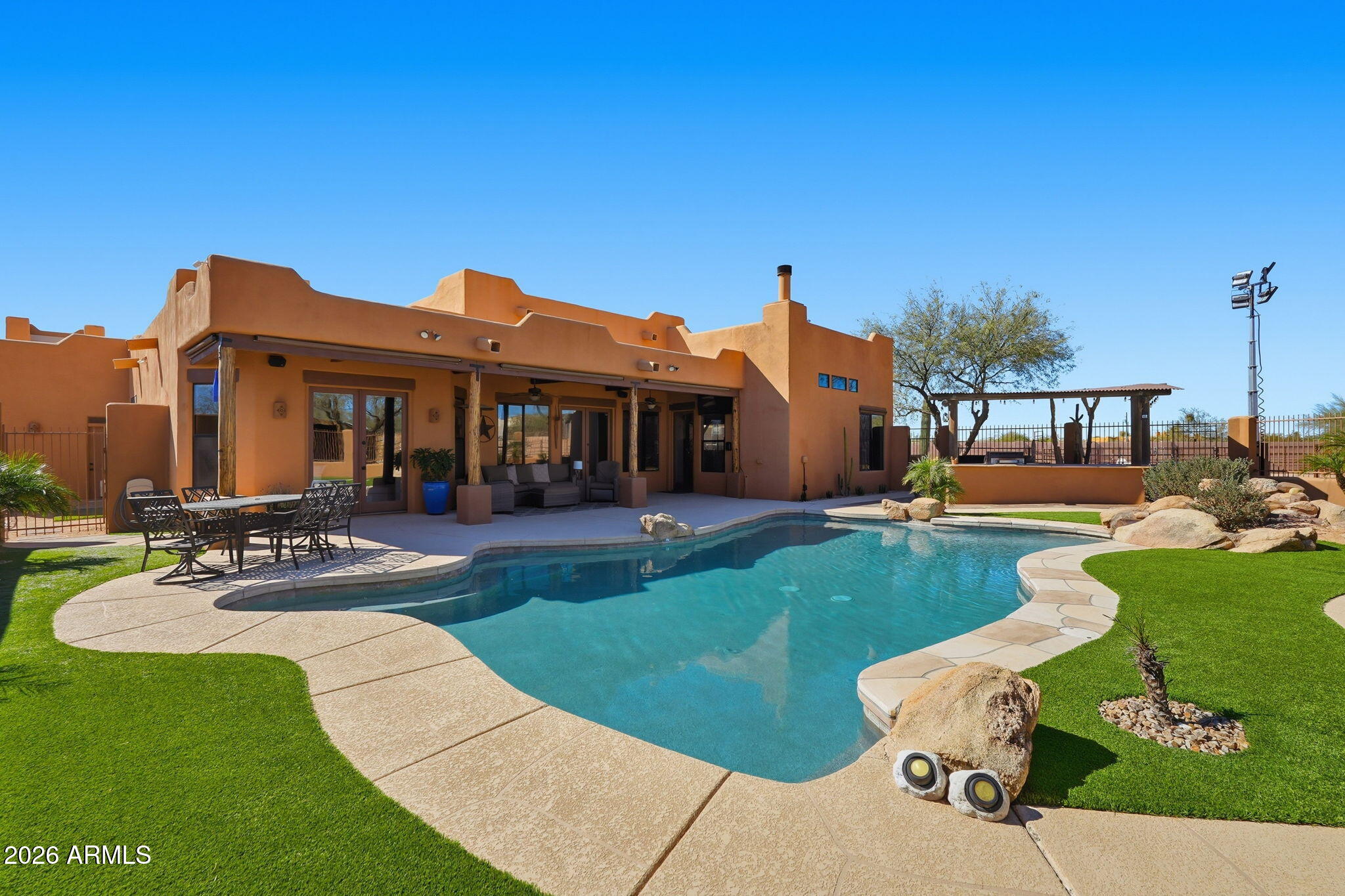 1114 East Carlise Road Phoenix, AZ 85086 - Photo 6 of 53 a view of a house with swimming pool patio and a garden