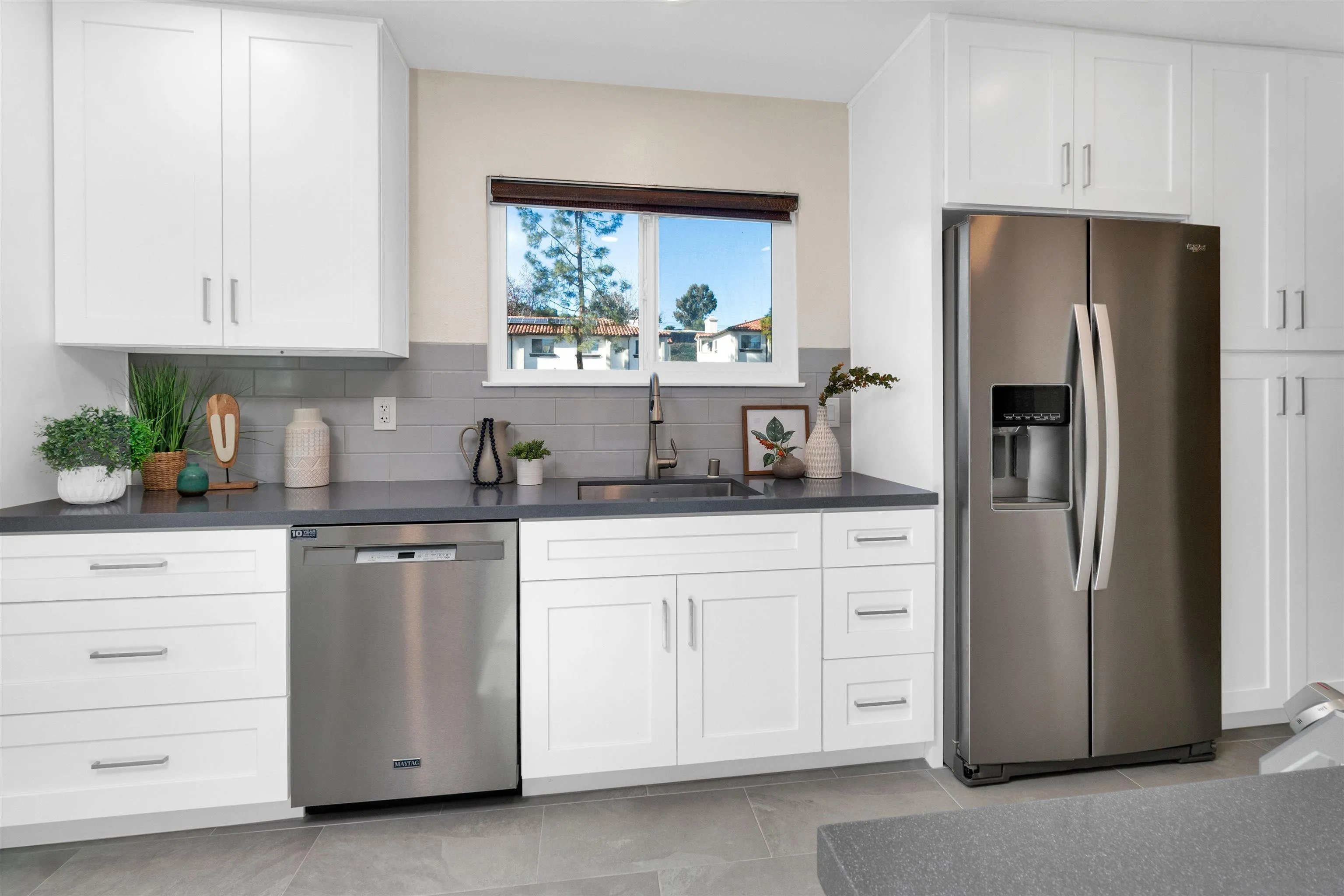 5685 Jackson Drive La Mesa, CA 91942 - Photo 11 of 24 a kitchen with white cabinets and refrigerator