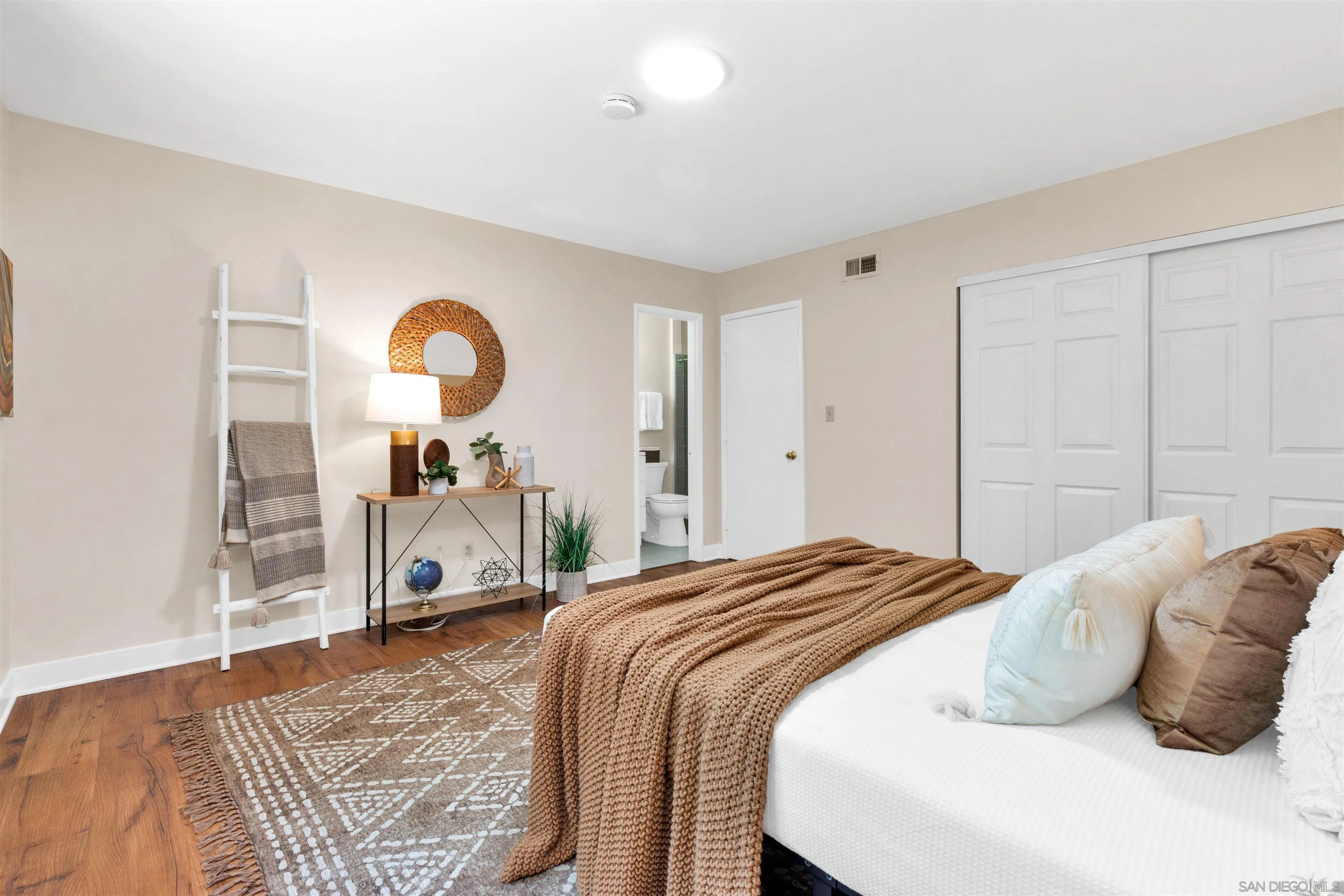 5685 Jackson Drive La Mesa, CA 91942 - Photo 17 of 24 a bedroom with a bed and a mirror