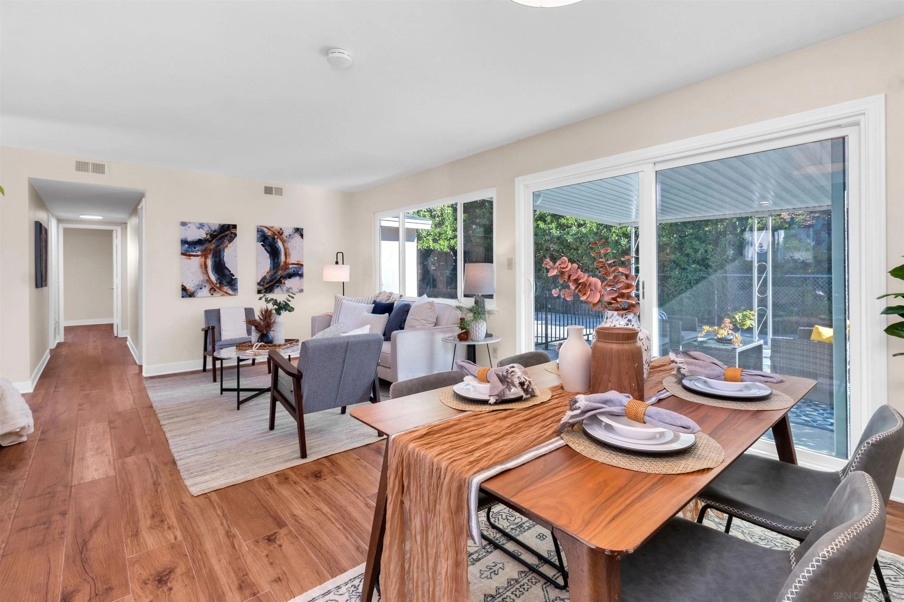5685 Jackson Drive La Mesa, CA 91942 - Photo 9 of 24 a living room with furniture a table and a large window