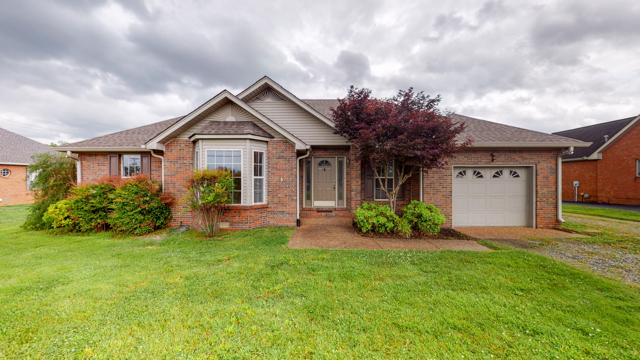 1883 Coles Ferry Pike Lebanon, TN 37087 - Photo 1 of 29 a front view of a house with garden