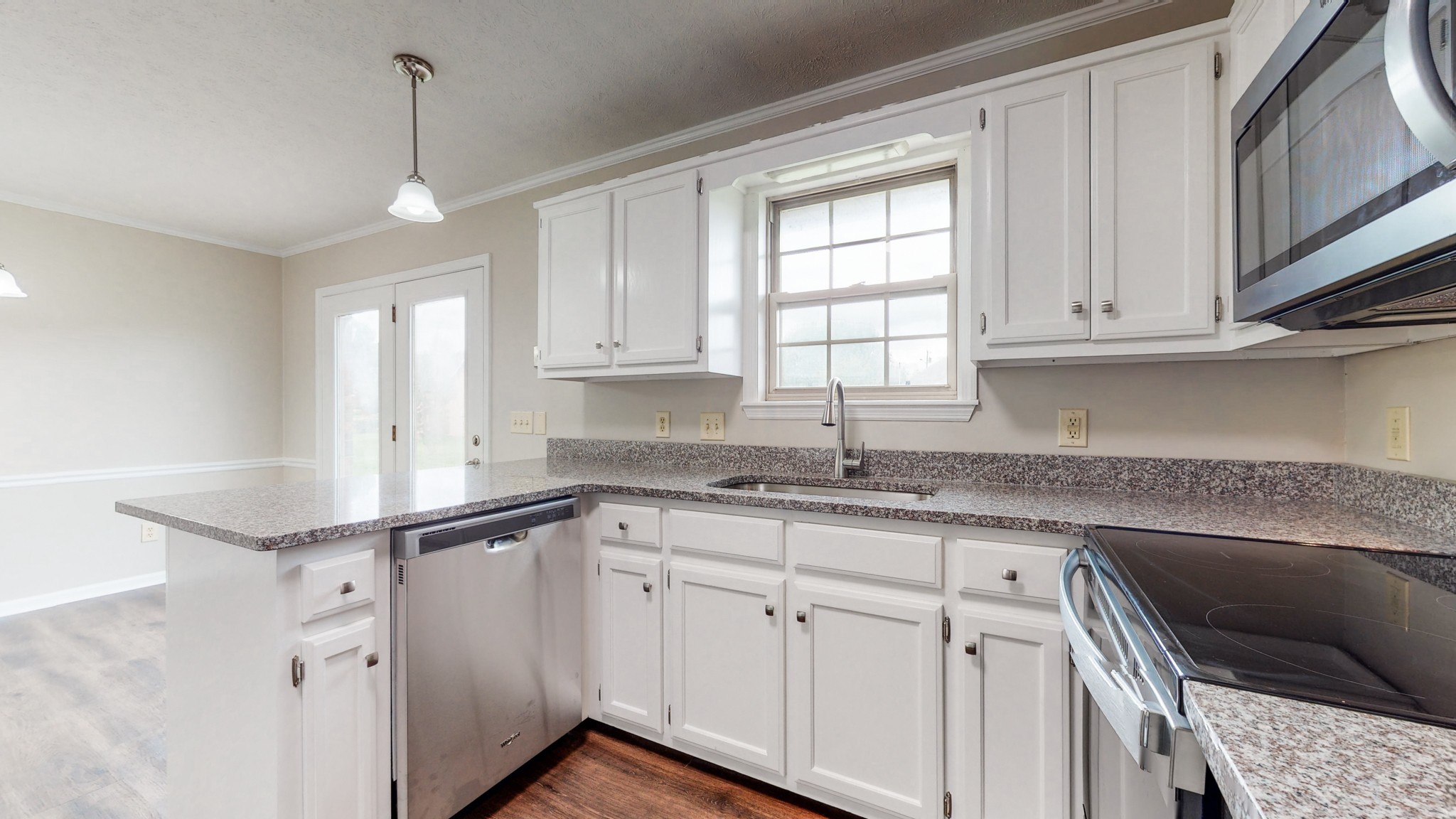 1883 Coles Ferry Pike Lebanon, TN 37087 - Photo 6 of 29 a kitchen with granite countertop white cabinets and white appliances