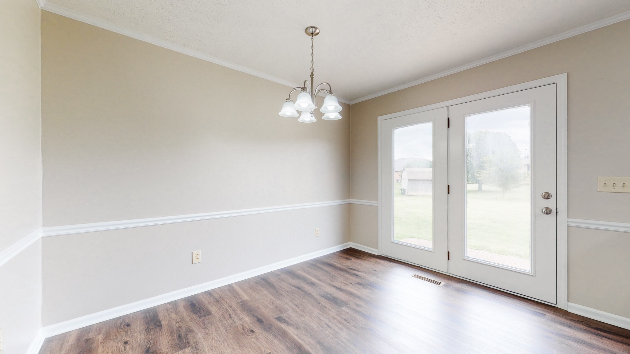 1883 Coles Ferry Pike Lebanon, TN 37087 - Photo 8 of 29 an empty room with wooden floor and windows