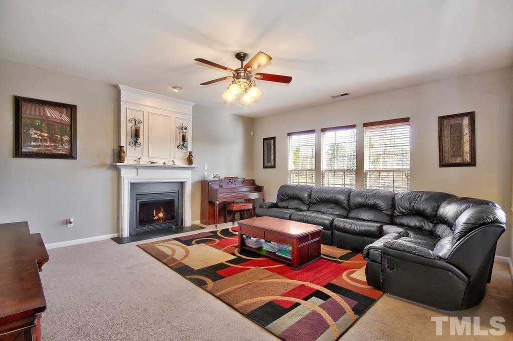 7754 San Gabriel Street Raleigh, NC 27613 - Photo 14 of 25 Cozy up to the gas fireplace during the winter with some hot cocoa and marshmallows.