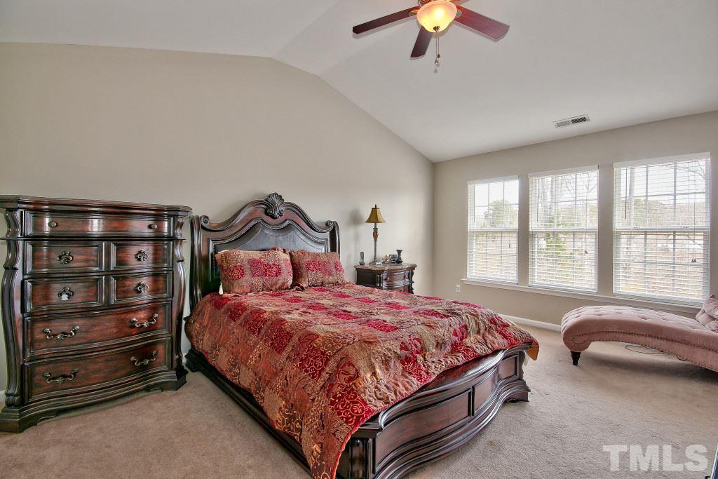 7754 San Gabriel Street Raleigh, NC 27613 - Photo 16 of 25 Cathedral ceilings with ceiling fan, very large bedroom includes an en suite.