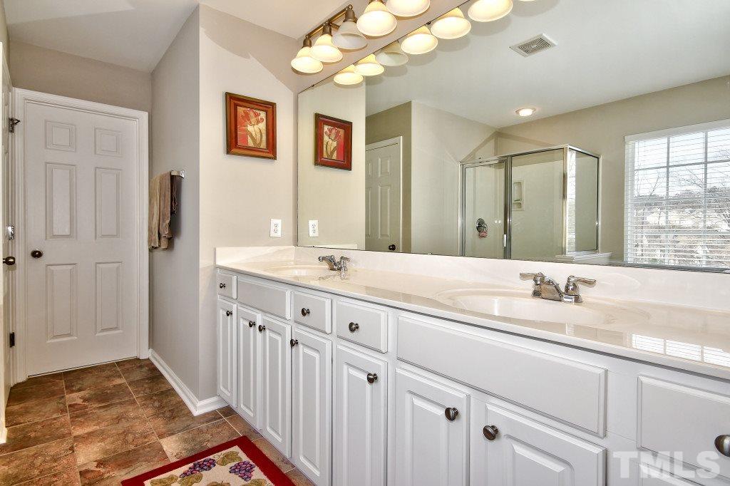 7754 San Gabriel Street Raleigh, NC 27613 - Photo 18 of 25 Beautiful master bath has a garden tub, separate shower, double vanity that is VERY large, a HUGE walk in closet and separate water closet. Very elegant!