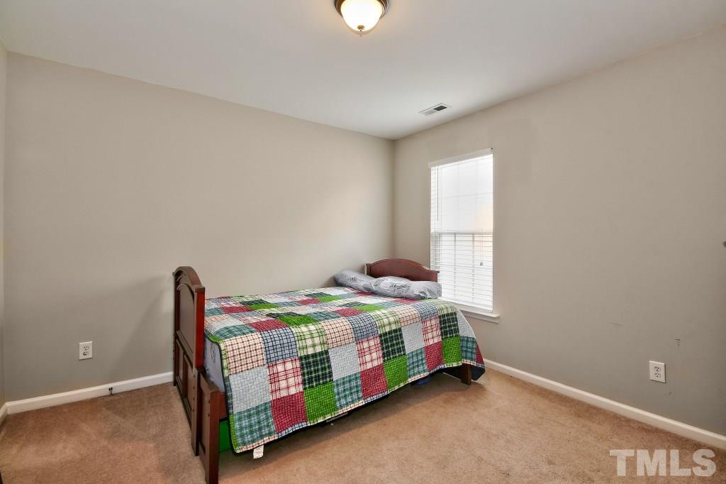 7754 San Gabriel Street Raleigh, NC 27613 - Photo 20 of 25 All of the bedrooms are large with great closets. The upstairs is carpeted and in great condition.