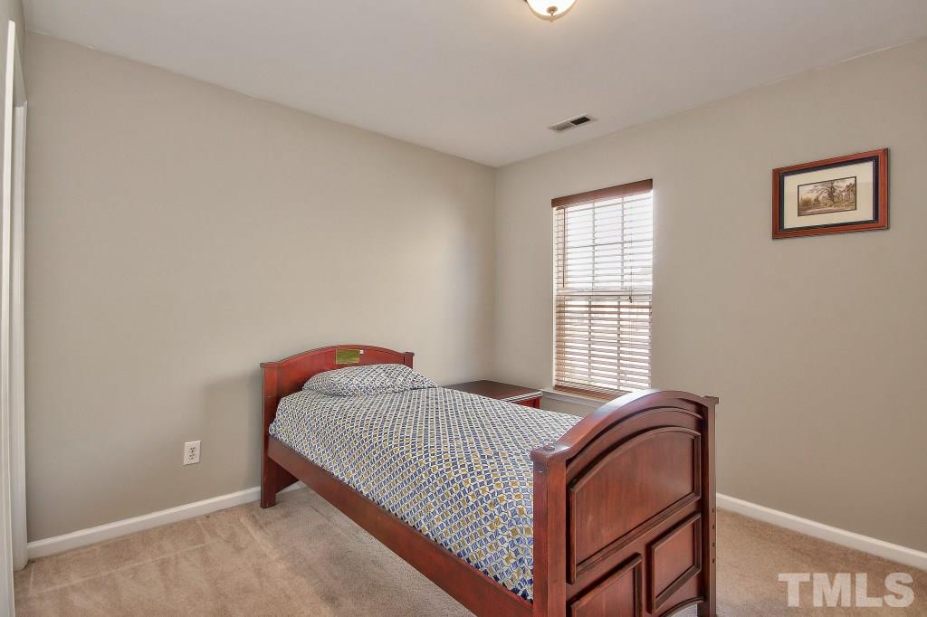 7754 San Gabriel Street Raleigh, NC 27613 - Photo 22 of 25 Upstairs among the four bedrooms, there is also a large laundry room which makes doing laundry so much easier and a large linen closet!