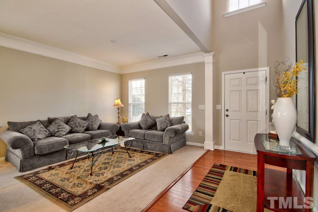 7754 San Gabriel Street Raleigh, NC 27613 - Photo 5 of 25 Large space features lots of windows to allow the natural light to come in, high ceilings and there is a 1/2 bath on the main level for guests.