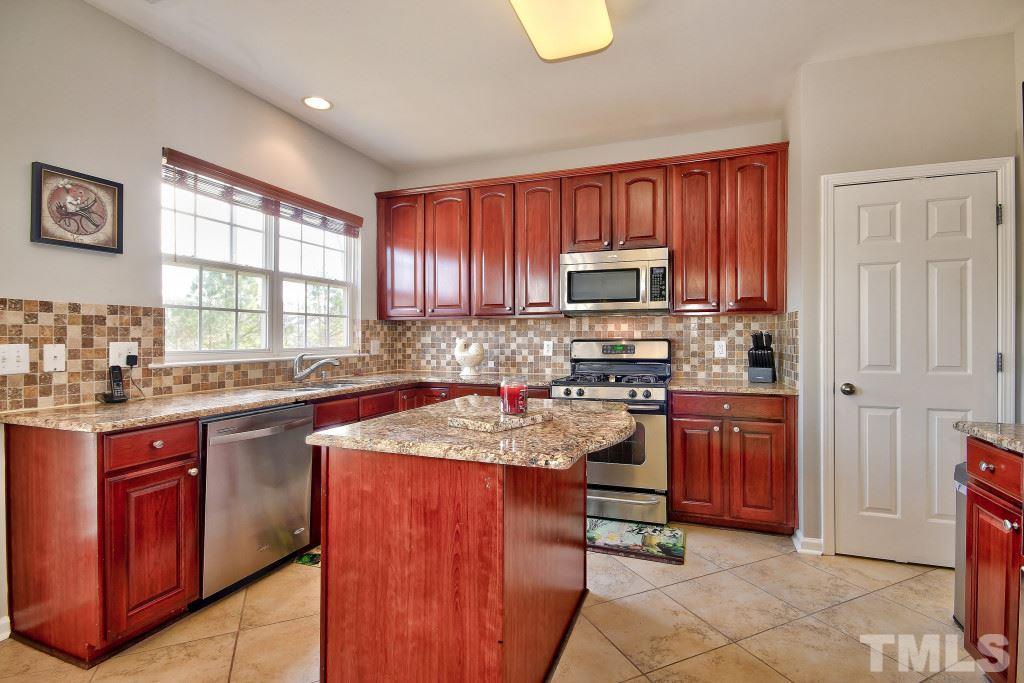 7754 San Gabriel Street Raleigh, NC 27613 - Photo 10 of 25 Gather around the granite island counter tops and enjoy coffee with your family!