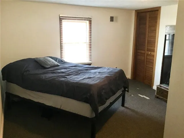 a view of walk in closet with clothes