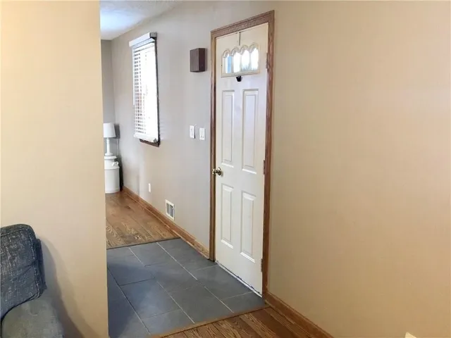 a view of a bathroom from a hallway