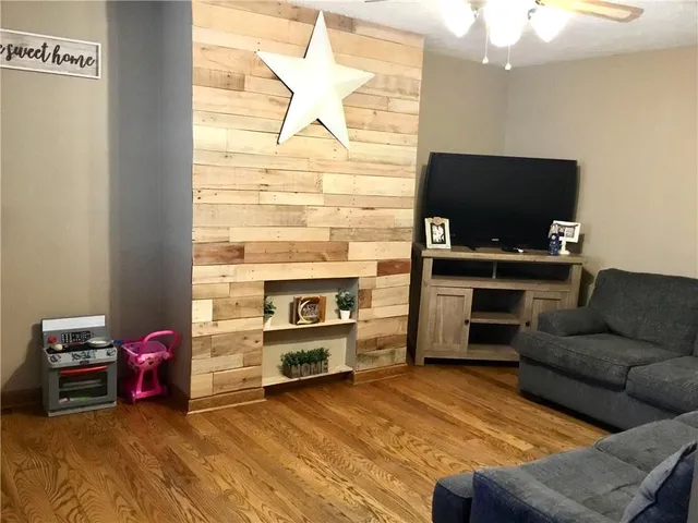a living room with furniture and a flat screen tv