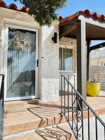 a view of a balcony with a potted plant