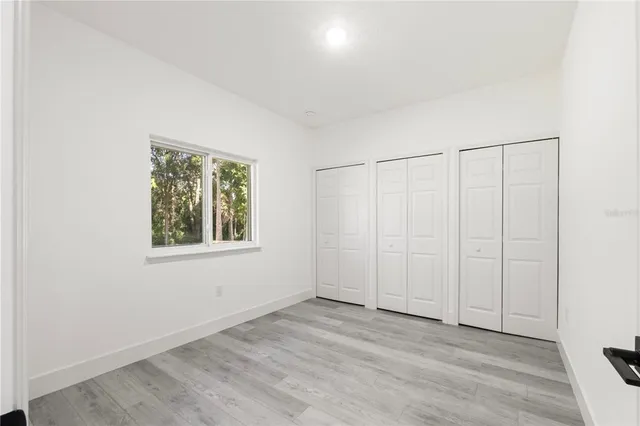 an empty room with a empty space and window