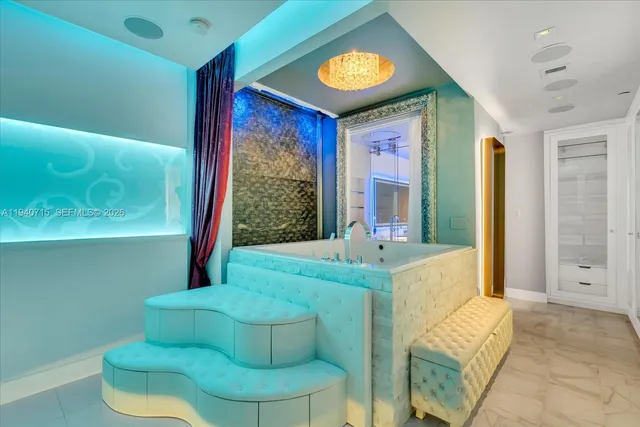 a kitchen with granite countertop white cabinets and stainless steel appliances