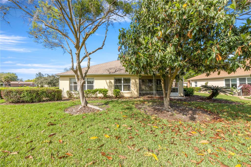 13421 Southeast 92nd Court Road Summerfield, FL 34491 - Photo 26 of 59 a view of a house with a yard