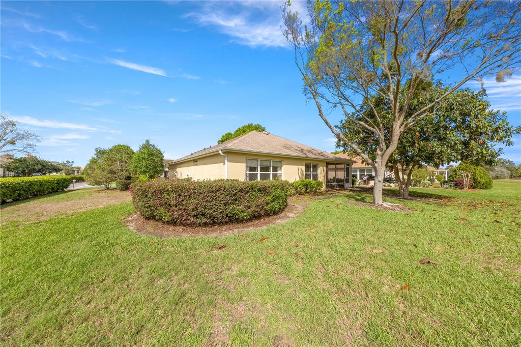 13421 Southeast 92nd Court Road Summerfield, FL 34491 - Photo 27 of 59 a front view of a house with a yard