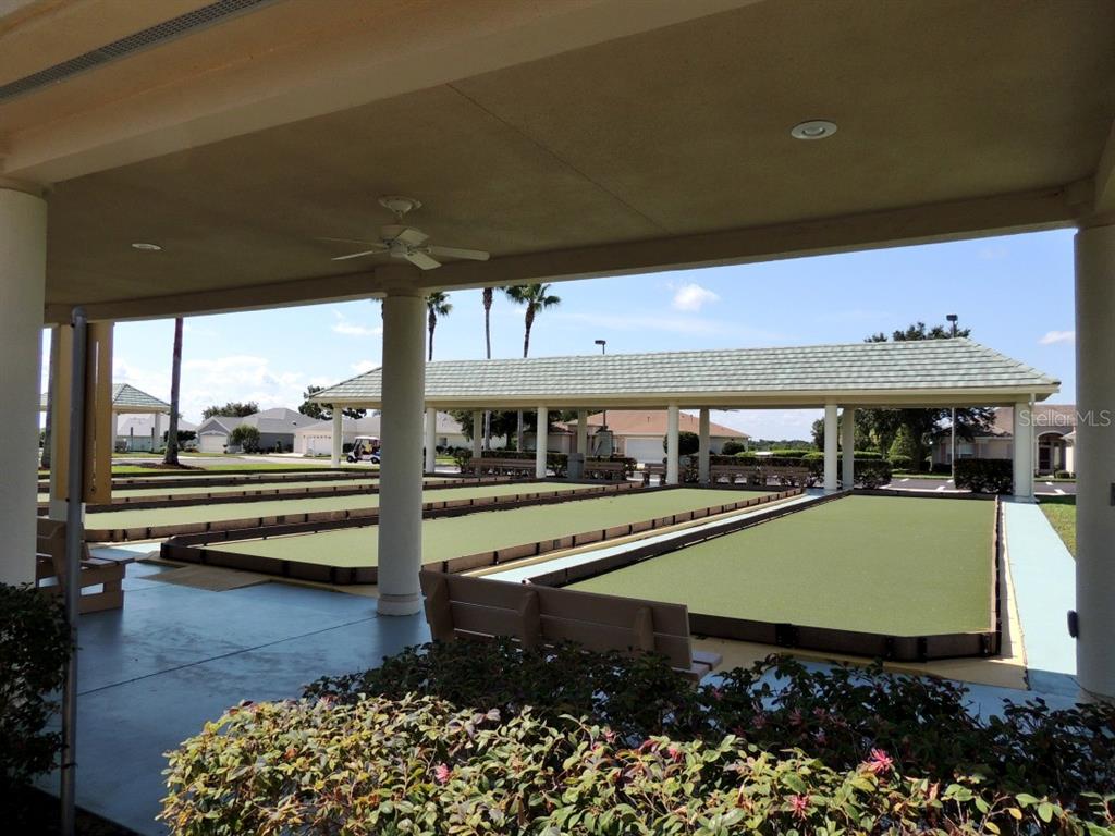 13421 Southeast 92nd Court Road Summerfield, FL 34491 - Photo 55 of 59 a view of a swimming pool with seating area