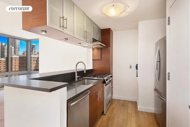a bathroom with a sink a toilet and bathtub