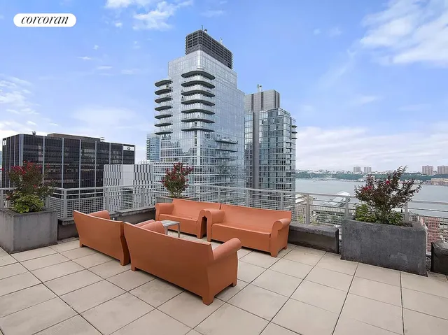 a kitchen with stainless steel appliances granite countertop a sink and a refrigerator
