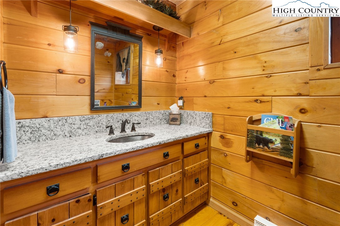 1748 Junaluska Road Boone, NC 28607 - Photo 23 of 37 a bathroom with a sink and a shower