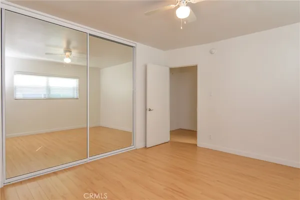 a view of an empty room with glass door