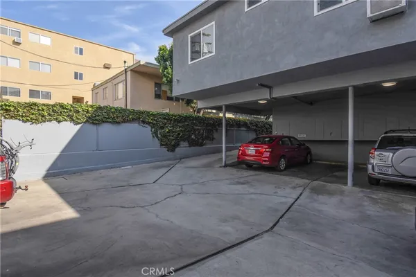 a view of parking with cars parked