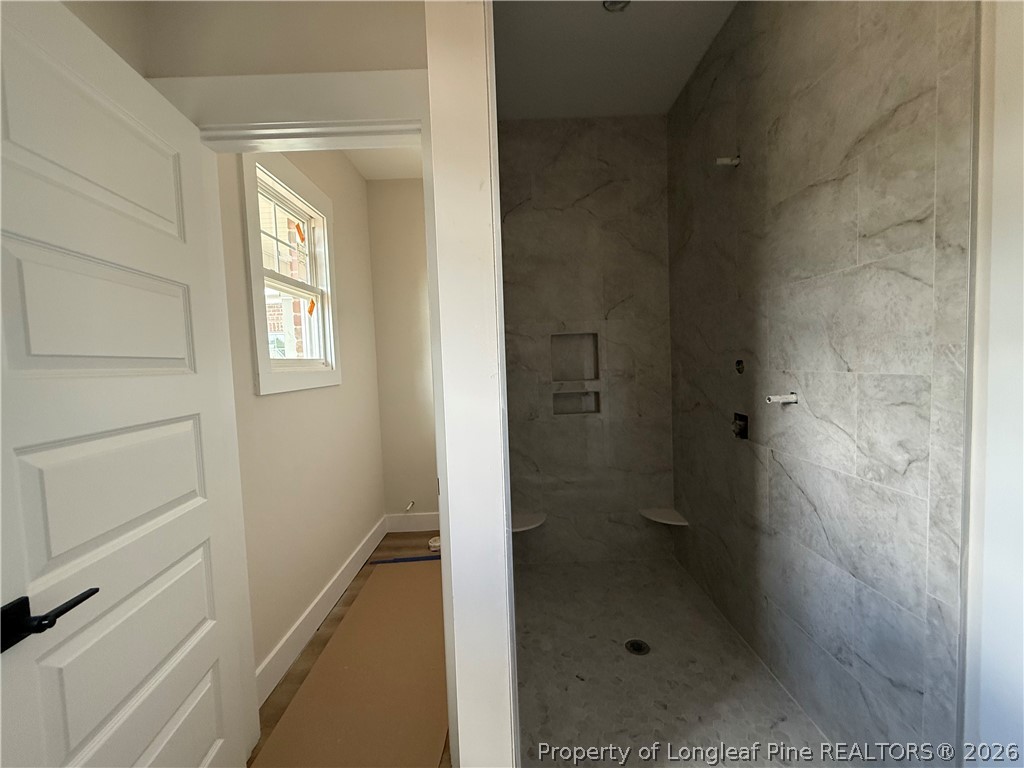154 Ridge Stone Drive Autryville, NC 28318 - Photo 9 of 17 a bathroom with a shower